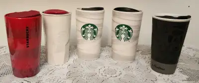 For sale are a selection of used Starbucks and Tim Hortons mugs, perfect for coffee or tea enthusias...