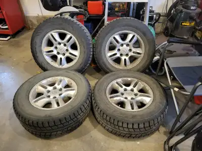 4 Toyo 265/65 17 winter tires with rims and lug nuts. Approximately 50% tred left thay are off a Lex...