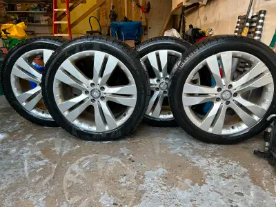 The 20-inch OEM Mercedes Benz rims, originally from a 2017 GL, show some signs of wear. They come eq...