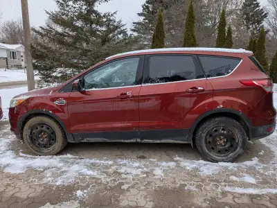 The 2014 Ford Escape is a versatile compact SUV featuring a modern design, seating for five, and thr...