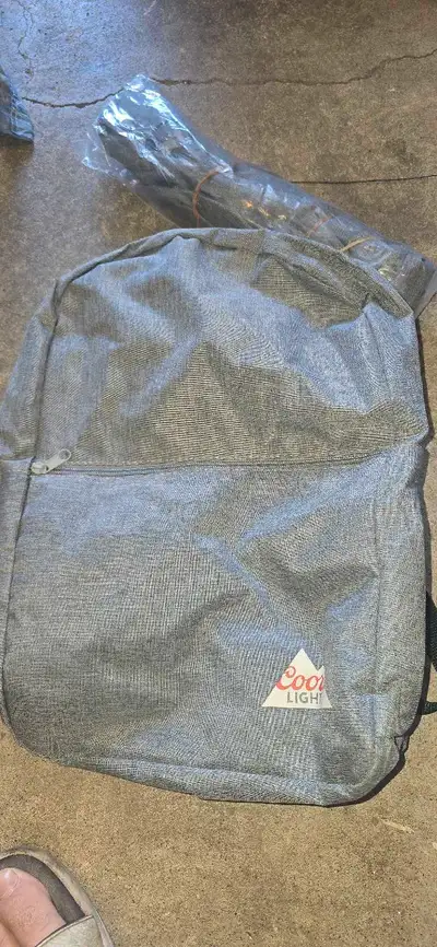 I'm selling a brand new Coors Light backpack, perfect for carrying your essentials while showing off...