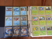 Cartable avec carte environ 80 cartes pokemon ( tout inclus )