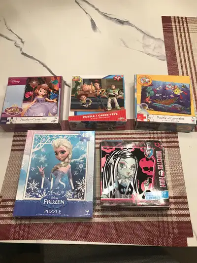 5 kids puzzles all complete . Frozen, Monster High,Toopy and Binoo,Toy Story , and Sofia the First ....