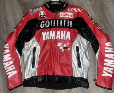 Vintage Motorcycle jacket. Leather/faux leather. Has built in removable shoulder, elbow and back arm...