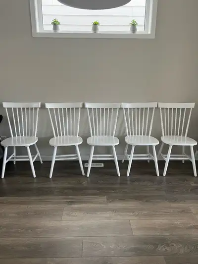 Six white dining chairs , View more