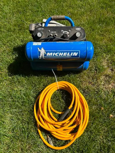 Portable air compressor, dual tanks. 1.1 HP working condition.