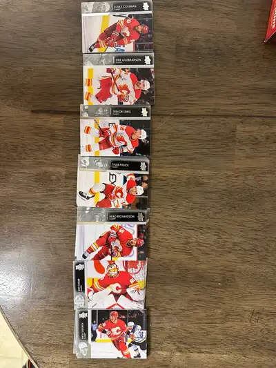 These Calgary Flames hockey cards feature various players from the team and are in used condition. A...