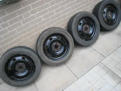 Four 16-inch wheels. Steel rims (rusty). Bolt pattern 5 x 114.3 mm. Center bore 67 mm. Two Farroad a...