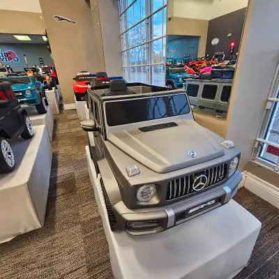 The Mercedes G63 features an eco-leather seat, rubber wheels, remote control for parents, USB and Bl...