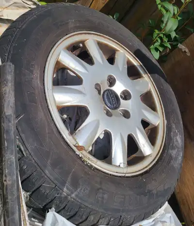 Used Set of 4 Volvo Rims with tires, perfect as winter set of rims or replace steelies with hubcaps...