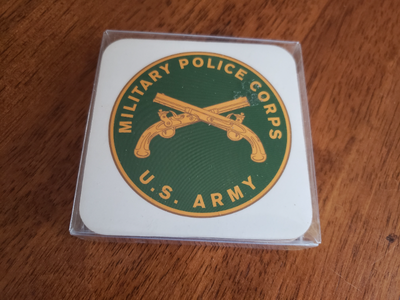 Here are four new in the package Military Police Corps U.S. Army thick cork backed coasters measurin...
