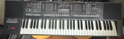 Professional Roland E-A7 arranger keyboard is black with a 61-note velocity-sensitive keyboard. It h...