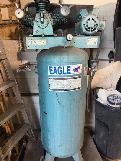 This is an Eagle air compressor, designed to deliver 18.5 CFM at 100 PSI, perfect for a range of pne...