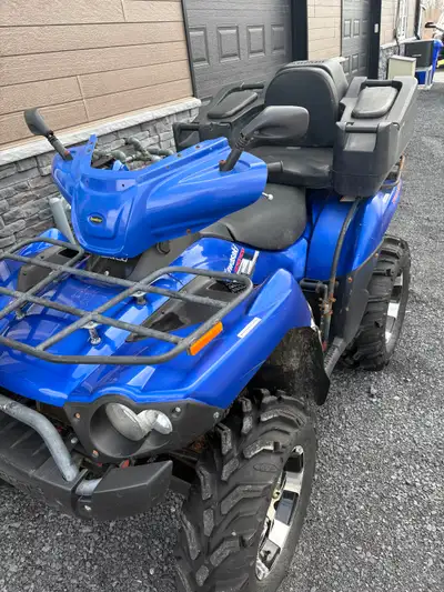 Brute force 750 runs drives needs battery comes with plow. Willing to trade for camper or pick up tr...