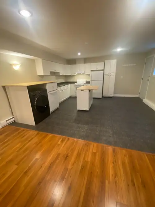 Freshly painted 1-bedroom basement suite (8' ceilings) with private rear entrance in a very quiet ne...