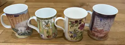 4 mugs- 2 garden 2 animal. $5 includes all. Pickup just off of 8th St.