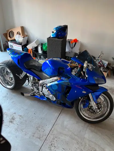 Bike has one sided swing arm with 330 tire on it with hydraulic system custom subzero paint job come...