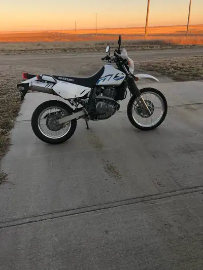 Get ready to explore with this like new 2023 Suzuki 650, a versatile dual-sport motorcycle perfect f...