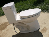 Used Toilet,  one piece, dual flush, good condition.