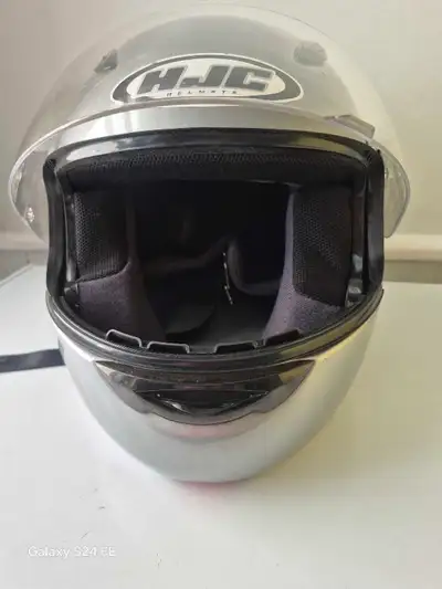 This HJC motorcycle helmet is in used condition and provides reliable head protection with its DOT c...