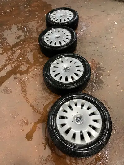 Selling 4 winter tires with Volkswagen rim cover. Tires size: 205/55R16 Hub bolt pattern: 5x112 2 ti...