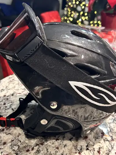I'm selling a Smith ski & snowboard helmet with goggles, perfect for hitting the slopes safely and i...