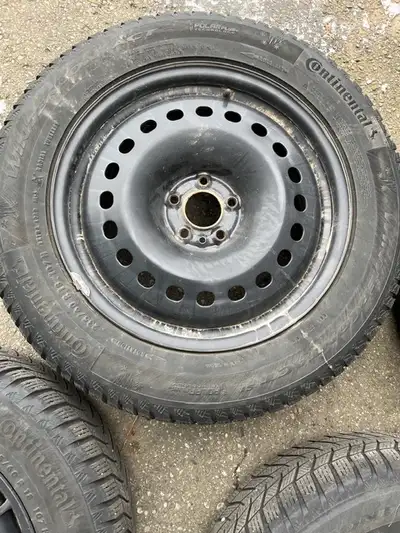 235/60 R18 continental winter contact tires on steel Jeep rims , where same height as the 19 inch su...