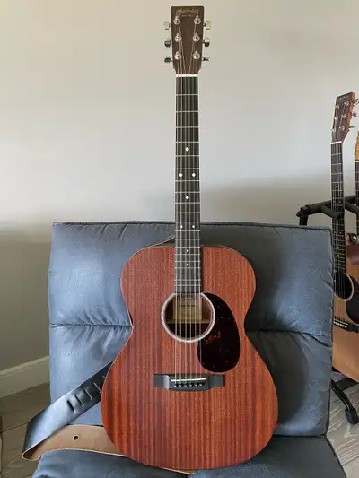 Selling my Martin 000-10e acoustic-electric guitar, known for its warm tones and comfortable playabi...