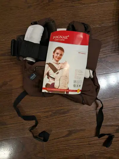 Never been used Pognae baby carrier designed for comfort and convenience. It features ergonomic supp...