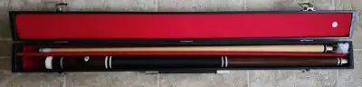 This is a used pool cue in good condition, perfect for recreational play. It's a standard 58-inch cu...