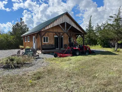 Discover the ultimate off-grid living on this vacant land featuring a spacious 2-bedroom cabin finis...