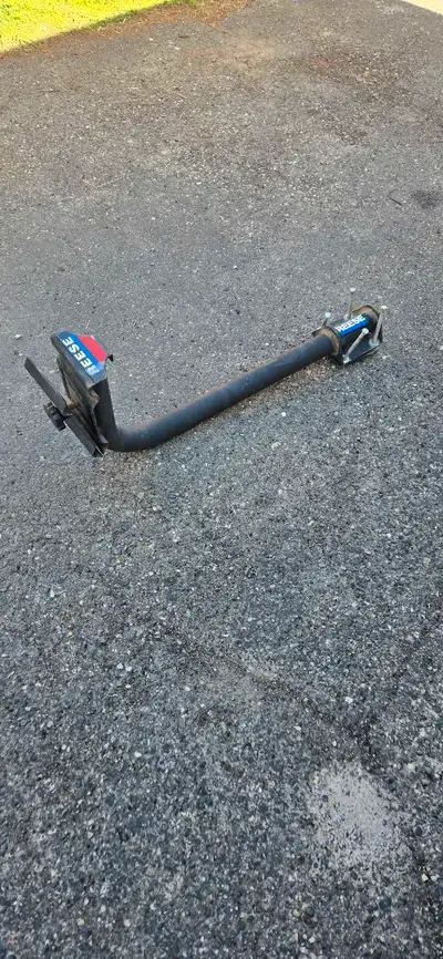 Reese bike rack. Can fit 2 bikes and clamps to travel trailer square tube bumper.