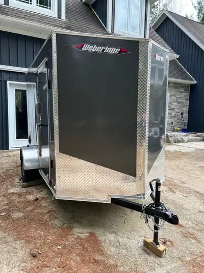 Used trailer once looks new- even smells new. Mint condition $7500 Weberlane 6x10 single axle enclos...