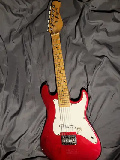 1 small Harmony electric guitar and guitar.books, View more