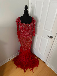 Beautiful evening gown with custom beading and feather tail