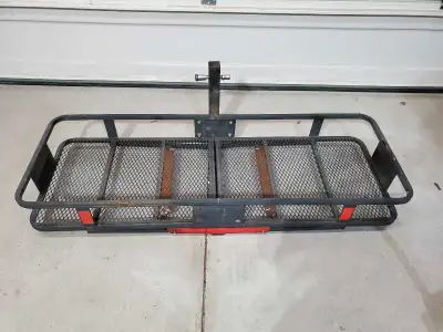 This is a used hitch-mount cargo rack, perfect for adding extra storage space to your vehicle. It's...