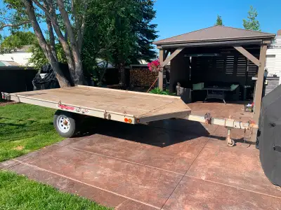 Newmans sled bed trailer. Has snowmobile ramp tucked away under the back. It’s set up to haul sleds...
