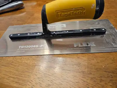TapeTech 12" premium gold finishing trowel. The blade is 0.65mm thick. * Suitable for drywall, plast...