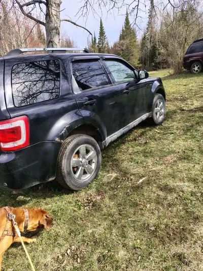 2009 Ford escape runs drives will need a emmision and battery for safety 233000 km, trade for a dirt...