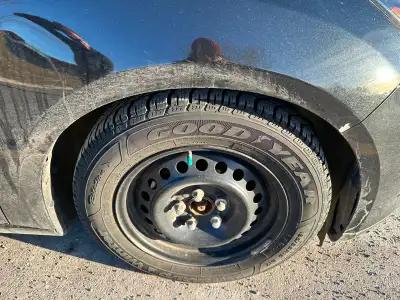 Set of four Goodyear Ultra-grip winter tires and rims. 195/65 R15 fit Ford. Low KM, like new. $500 f...