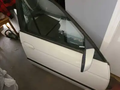 A complete front passenger door for all 5 Series E39 BMW's, 1997-2003 (Sedan) or 1999-2001 (Touring)...