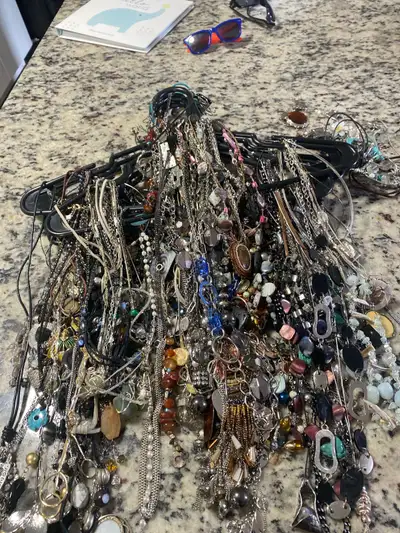 100’s of costume necklaces, and beads, some even with price tags still on, 10$ each or can do better...