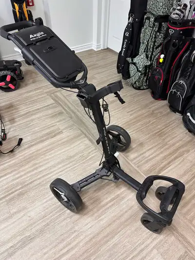 In great condition golf push cart 4 wheels Compact and Light weight Hand brakes for easy access 2 la...