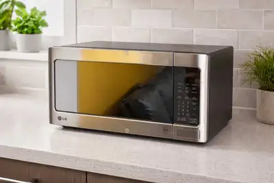 This is a used LG stainless steel microwave with 1.1cu ft capacity, perfect for reheating leftovers...