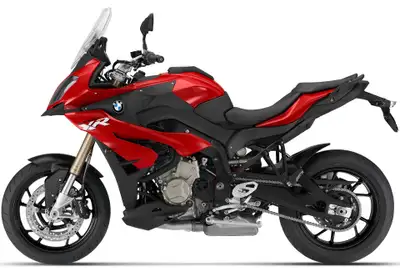 Purchased new and is easily the best bike I've ever owned. Includes saddle bags, a tank bag and a GP...
