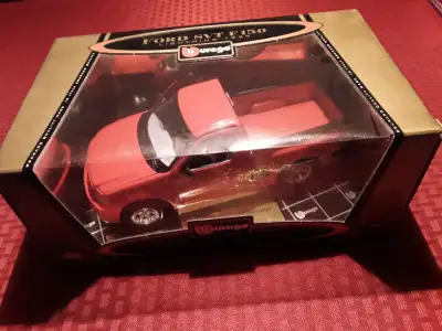 For sale is a 1:21 scale die cast model of a 1999 Ford SVT F150 Lightning by Burago. Item and box ar...