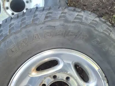 Selling my wheels and tires off my 2001 ram 2500. the tires are General Grabber A/T 285/75/16. Three...