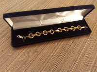 Yellow gold bracelet stamped 10K . 7 inches. 7.8 grams. ...