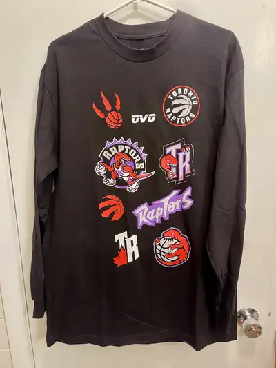 Show your Raptors pride with this OVO (October's Very Own) long sleeve T-shirt, perfect for any fan...