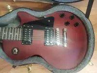 Worn Cherry Epiphone Les Paul Studio with hard case and strap